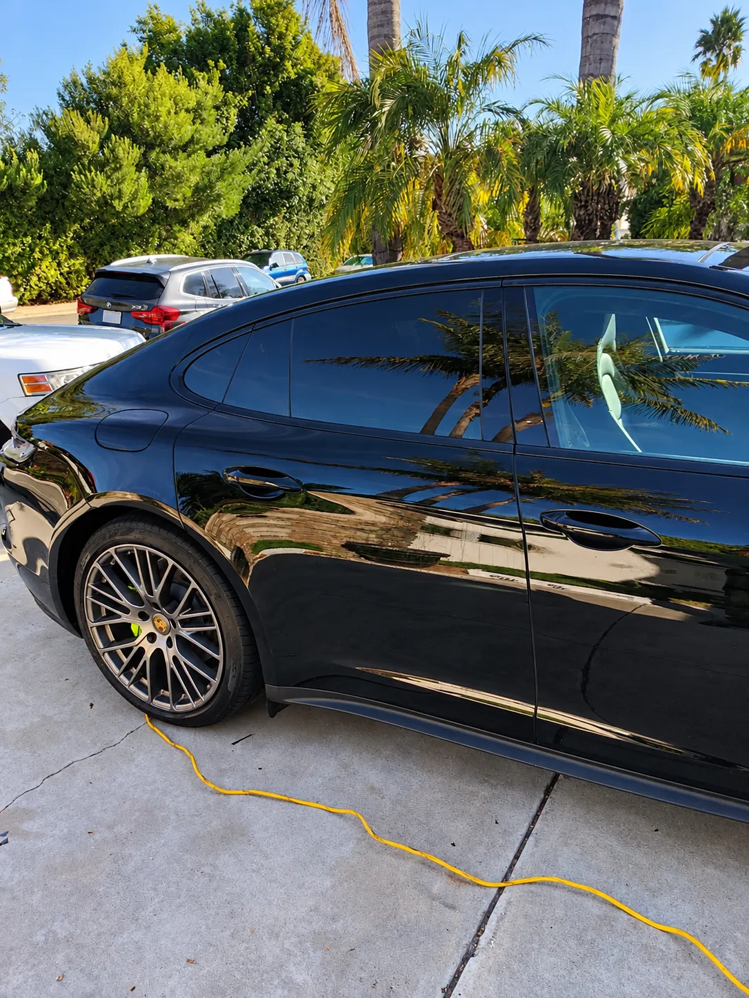 Glossy black Porsche with freshly tinted windows